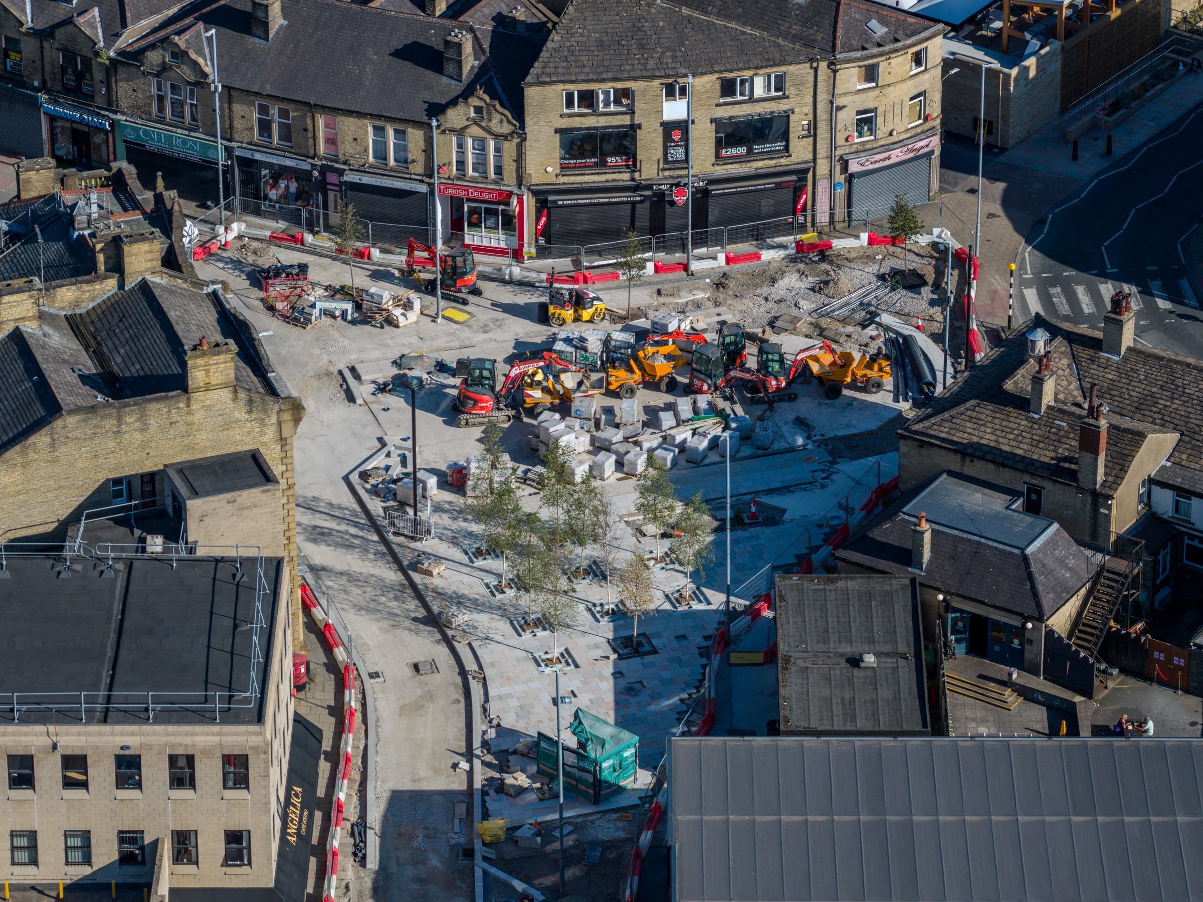 Aerial of town centre works with machinery on site